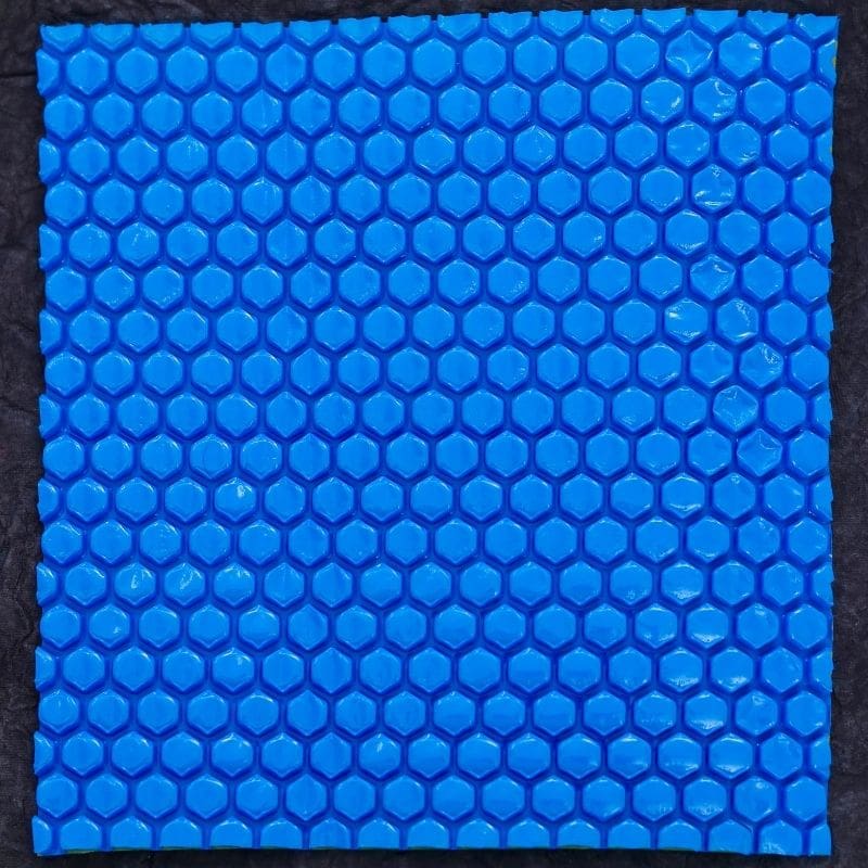 Hexagon cooling pad for thermal management, high-density blue honeycomb cooling structure, used in air conditioning and refrigeration systems.
